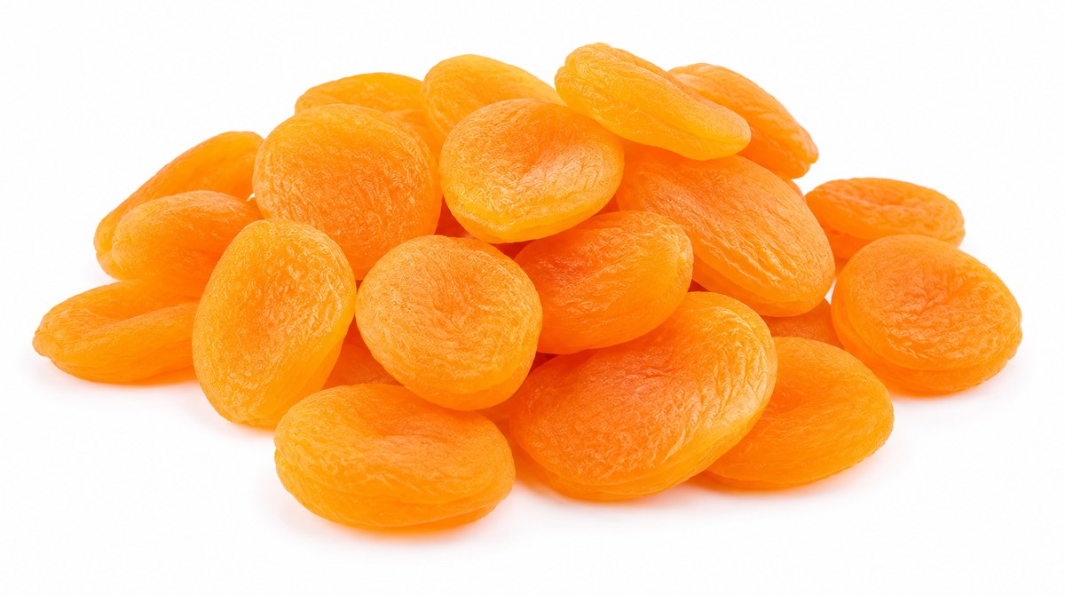 A pile of whole sun-dried apricots